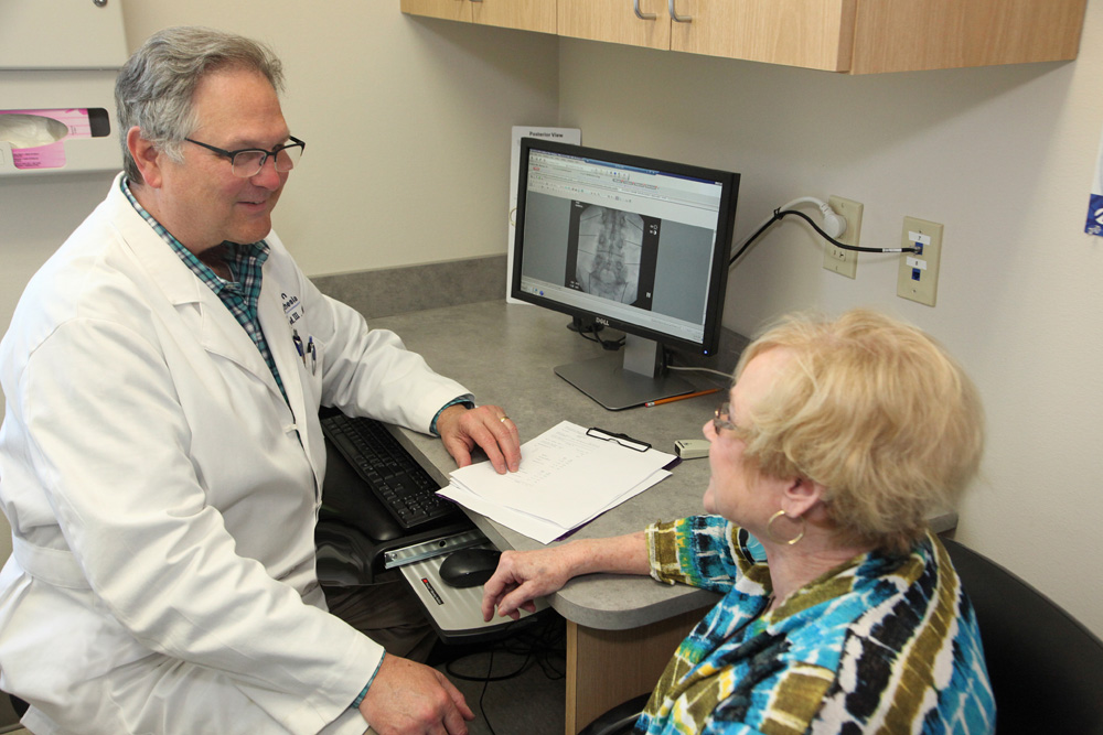 Doctor speaking with woman