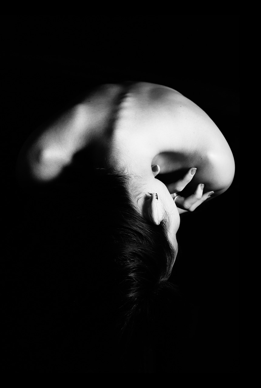 B&W photo of woman's back and spine