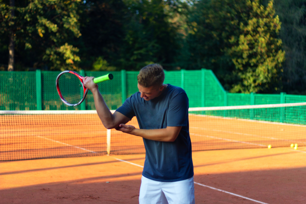 Tennis player with tennis elbow pain