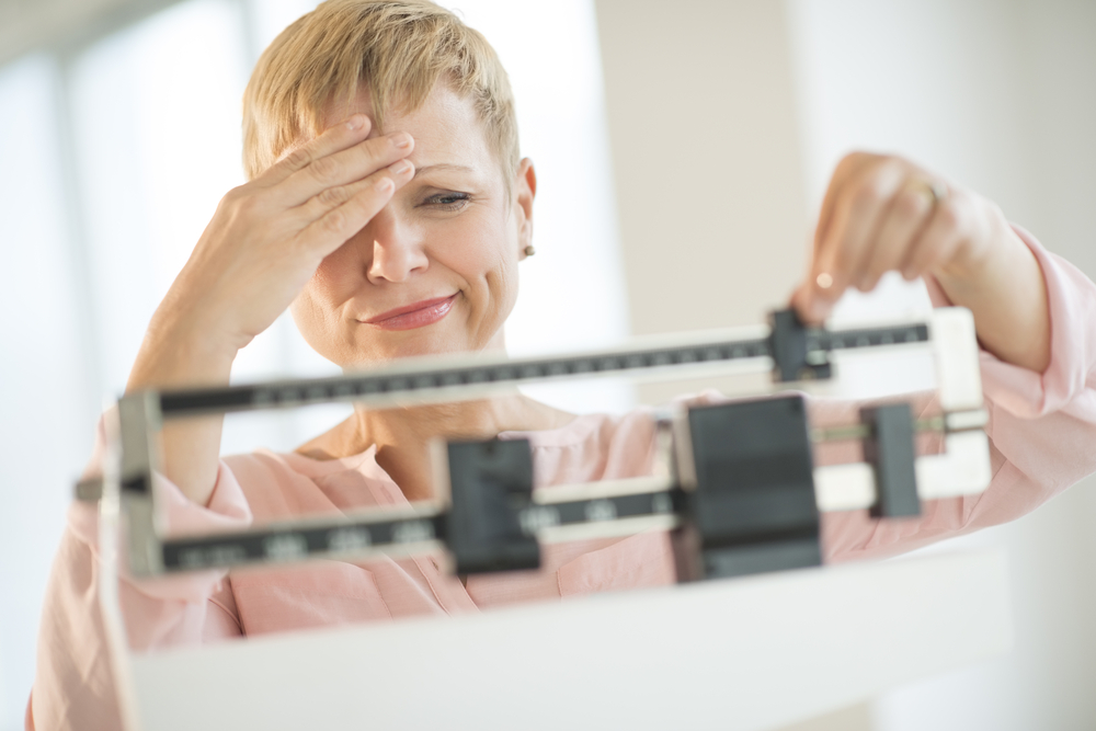 fibromyalgia woman on scale wight gain