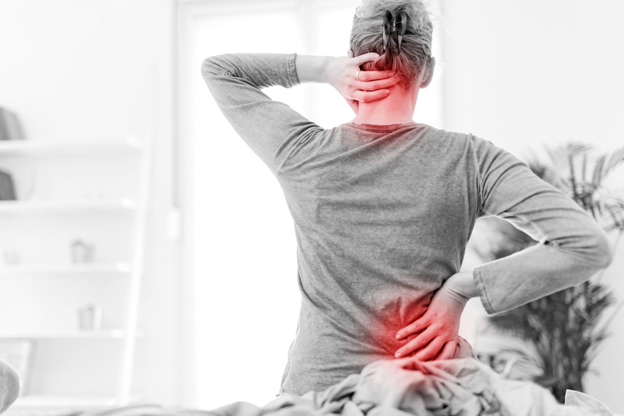 man with neck and back pain