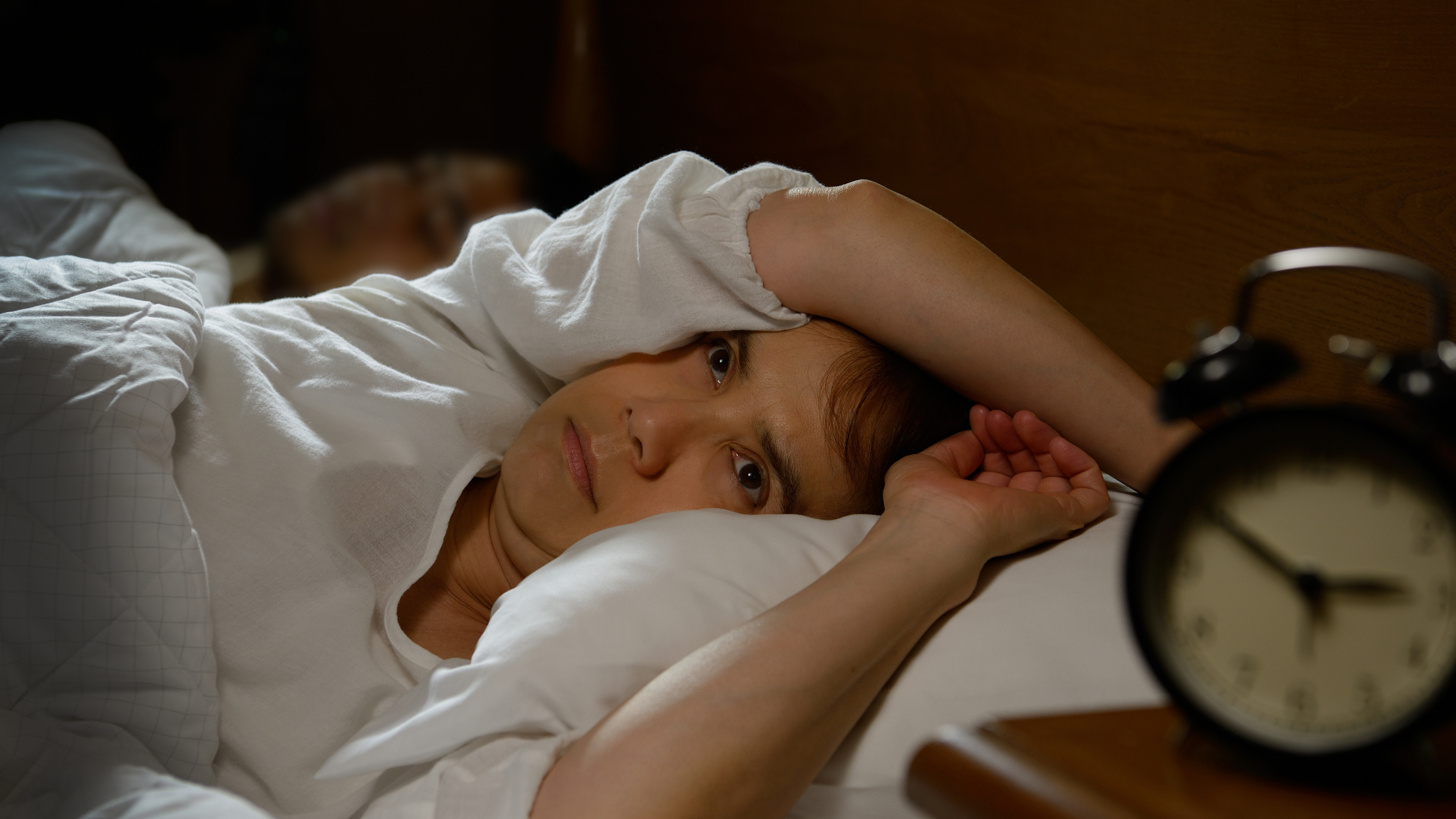 woman with chronic pain and insomnia